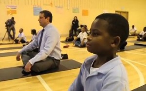 Rep. Tim Ryan meditates with schoolchildren.